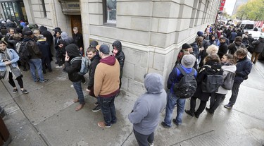 The line outside the Société québécoise du cannabis store on Ste-Catherine St. W. in Montreal snakes around the corner down Metcalfe St. Oct. 17, 2018.