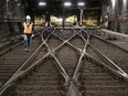 Yannick Warin, engineer at Exo, walks along the tracks leading into the Mount Royal Tunnel on Sunday. The tunnel celebrated 100 years of operation and will see a new life with the Réseau express métropolitain.