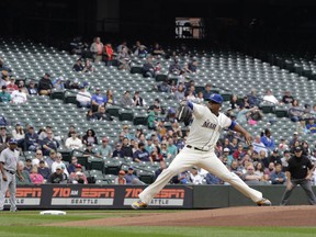 In this Sept. 30, 2018, file photo, empty seats are shown at Safeco Field as Seattle Mariners starting pitcher Roenis Elias throws against the Texas Rangers during the first inning in Seattle. Major League Baseball's attendance dropped to its lowest level since 2003, and six stadiums set record lows.