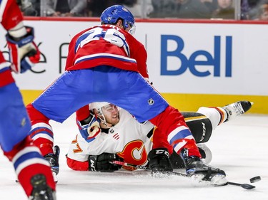 Jeff Petry drags down Calgary Flames Mark Jankowski during second period in Montreal Tuesday, Oct. 23, 2018.