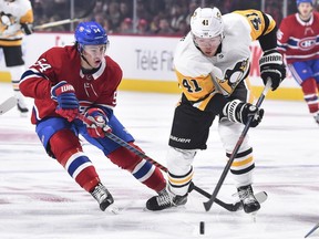 Canadiens' Charles Hudon, left, battles Penguins' Daniel Sprong during game at the Bell Centre this month.