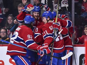 The  Canadiens celebrate a goal by Tomas Tatar (not pictured) against the Pittsburgh Penguins at the Bell Centre on Saturday, Oct. 13, 2018, in Montreal.