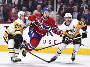 Habs fans are being treated to a fun bunch of young Canadiens this season who are reminding us why we watch in the first place. Above, Jonathan Drouin skates through Sidney Crosby, left, and Kris Letang of the Pittsburgh Penguins at the Bell Centre on Saturday, Oct. 13, 2018.