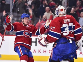 Canadiens' Max Domi reacts with goaltender Antti Niemi after defeating the Pittsburgh Penguins 4-3 in a shootout at the Bell Centre on Saturday, Oct. 13, 2018.