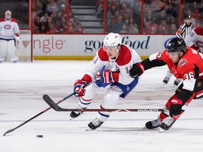 Brendan Gallagher of the Montreal Canadiens skates with the puck against Colin White of the Ottawa Senators in the first period at Canadian Tire Centre on Oct. 20, 2018, in Ottawa.