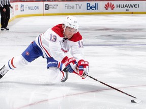 The Canadiens’ Max Domi falls to the ice as he tries to control puck in NHL game against the Senators at Ottawa’s Canadian Tire Centre on Oct. 20, 2018.