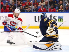 Canadiens' Jonathan Drouin fires the puck at Sabres goalie Carter Hutton during first period at the KeyBank Center in Buffalo on Thursday night.