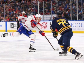Max Domi of the Montreal Canadiens scores his second goal of the game as Evan Rodrigues of the Buffalo Sabres defends during the third period at the KeyBank Center on Oct. 25, 2018, in Buffalo.