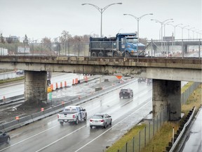 A dump truck crosses the old Doney Spur rail overpass, which will be torn down this weekend, forcing the closure of a stretch Highway 40 — including the service road — in both directions.