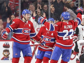 Canadiens defenceman Shea Weber, left, celebrates after scoring against the Arizona Coyotes with teammates Karl Alzner and Tomas Plekanec during NHL game at the Bell Centre in Montreal on Nov. 16, 2017.