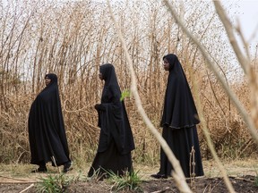 Women wearing black chadors in Nigeria.