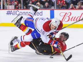 Montreal Canadiens' Andrew Shaw, checking checking Michael Stone of the Flames in Calgary on Dec. 22, 2017, could be in the Habs' lineup for the 2018-19 season-opener in Toronto