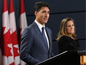 Prime Minister Justin Trudeau (L) and Minister of Foreign Affairs Chrystia Freeland (R) speak at a press conference to announce the new USMCA trade pact between Canada, the United States, and Mexico in Ottawa, October 1, 2018.