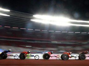 Athletes compete in the men's 5000-metre T53/54 final of the 2018 Asian Para Games in Jakarta on Oct. 12, 2018.