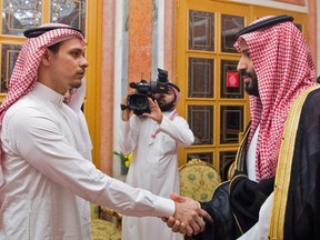 A photo provided by the Saudi Press Agency shows Saudi Crown Prince Mohammed bin Salman, right, meeting with family members of slain journalist Jamal Khashoggi in Riyadh. The Saudi rulers met with Khashoggi's son Salah and brother Sahel at the royal palace, state-run news agency SPA reported. The report said King Salman and Prince Mohammed offered their condolences to the family of the slain journalist.