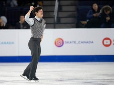 Canada's Keegan Messing celebrates after his short program at the 2018 Skate Canada International ISU Grand Prix event in Laval, Quebec, October 26, 2018.