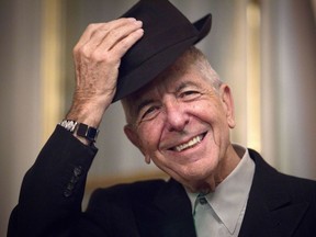 This file photo taken on January 16, 2012, shows Canadian singer and poet Leonard Cohen taking off his hat to salute in Paris.