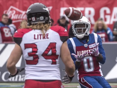 Calgary Stampeders running back Ante Milanovic-Litre watches Montreal Alouettes running back Stefan Logan catch a pass during first-half CFL action at Molson Stadium in Montreal on Monday, Oct. 8, 2018.