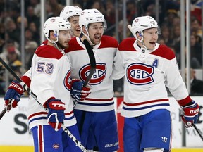 Montreal Canadiens' Brendan Gallagher, right, celebrates his goal against the Boston Bruins with Victor Mete (53) and Artturi Lehkonen during the first period on Oct. 27, 2018, in Boston.