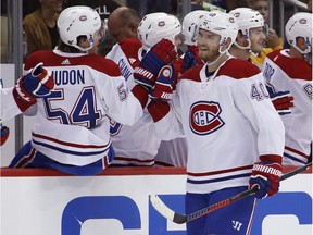 Montreal Canadiens' Joel Armia celebrates his goal as he returns to the bench in the second period against the Penguins in Pittsburgh on Oct. 6, 2018.