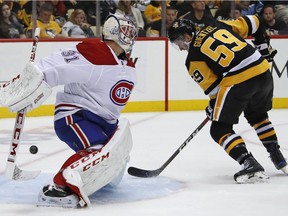 Penguins' Jake Guentzel cannot get a shot past Montreal Canadiens goaltender Carey Price  in the second period in Pittsburgh on Saturday, Oct. 6, 2018.