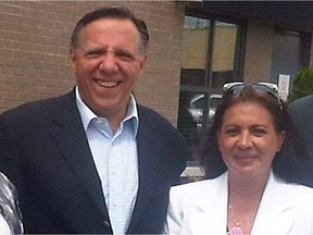 François Legault poses with Paola Hawa, who ran unsuccessfully for the CAQ in the 2012 election in Jacques-Cartier.