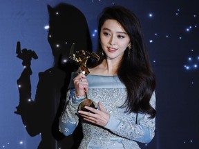 FILE - In this March 21, 2017, file photo, Chinese actress Fan Bingbing poses after winning the Best Actress Award of the Asian Film Awards in Hong Kong. Fan Bingbing, one of China's best-known starlets and a rising Hollywood star, has well and truly fallen off the map amid vague allegations of tax shenanigans and possibly other infractions that have put her at odds with China's Communist Party-appointed culture czars.