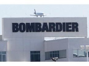 A plane comes in for a landing at a Bombardier plant in Montreal, Thursday, May 14, 2015.