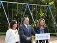 François Legault, with candidates Isabelle Charest, left, and Geneviève Hébert back on Aug. 27, 2018.