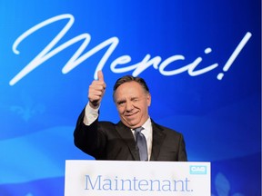 Coalition Avenir du Quebec leader and premier-elect Francois Legault speaks to supporters from the podium as he celebrates after winning the Quebec Provincial election in Quebec City on Monday, October 1, 2018.