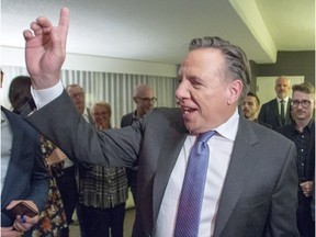 Coalition Avenir Québec Leader and Premier-elect François Legault celebrates with supporters after winning the Quebec election.