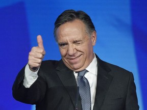 Coalition Avenir du Quebec leader and premier-elect Francois Legault speaks to supporters from the podium as he celebrates after winning the Quebec Provincial election in Quebec City on Monday, October 1, 2018.