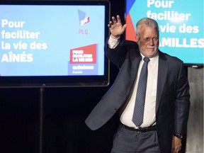Quebec Liberal Leader Philippe Couillard waves to supporters after he lost the general election to a majority CAQ government, Monday, October 1, 2018 in Saint-Felicien, Quebec. The Liberals' loss, and the CAQ's weak respresentation on Montreal island, creates problems for the metropolis, Martin Patriquin writes.