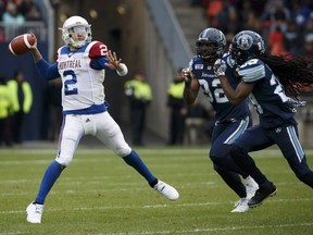 Alouettes quarterback Johnny Manziel gets a throw off as he avoids Toronto Argonauts defence against the Toronto Argonauts, in Toronto, Saturday, Oct. 20, 2018.