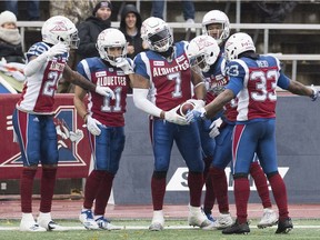 Alouettes' John Bowman (7) celebrates with teammates after scoring a touchdown against the Toronto Argonauts in Montreal on Sunday, Oct. 28, 2018.