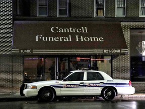 A Detroit Police vehicle is parked outside the Cantrell Funeral Home in Detroit on Friday, Oct. 12, 2018.