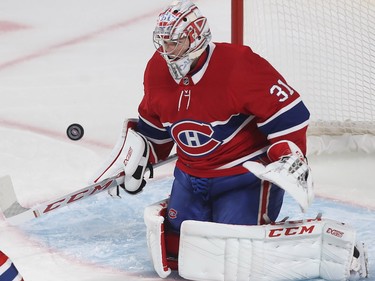 Carey Price stops shot during first-period NHL action in Montreal on Thursday, Oct. 11, 2018.