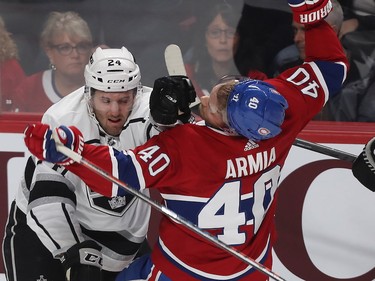 Los Angeles Kings' Derek Forbort gives hit on Joel Armia during first-period NHL action in Montreal on Thursday, Oct. 11, 2018. (Pierre Obendrauf / MONTREAL GAZETTE)