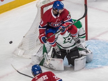 Montreal Canadiens centre Matthew Peca (63) leaps out of the way in front of Dallas Stars goaltender Ben Bishop from a shot by teammate left wing Nicolas Deslauriers during first-period action on Tuesday, Oct. 30, 2018.