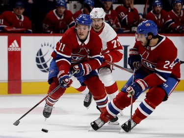 Right wing Brendan Gallagher carries the puck over the blue line as Detroit Red Wings centre Dylan Larkin follows behind in Montreal on Monday, Oct. 15, 2018. Centre Phillip Danault, right, looks on.