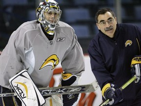Buffalo Sabres goalie coach Jim Corsi, right, works with Sabres goalie Ryan Miller during NFL hockey practice at HSBC Arena in Buffalo on April 19, 2007. Analytics are used by NHL teams to help assess players, plot tactics and prepare for opponents.