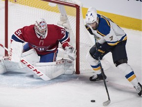 St. Louis Blues' Pat Maroon moves in on Montreal Canadiens goaltender Carey Price during first period in Montreal on Oct. 17, 2018.