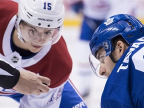 Montreal Canadiens rookie centre Jesperi Kotkaniemi takes a faceoff against Toronto Maple Leafs' John Tavares in Toronto on Oct. 3, 2018.