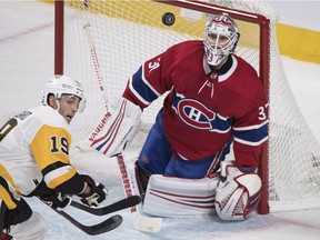 Canadiens goaltender Antti Niemi keeps his eyes on the puck as Pittsburgh Penguins' Derick Brassard moves in during first period NHL hockey action at the Bell Centre in Montreal on Saturday, Oct. 13, 2018.