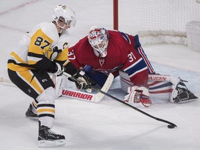 Montreal Canadiens goaltender Antti Niemi makes a save against Pittsburgh Penguins' Sidney Crosby during shootout in Montreal on Oct. 13, 2018.