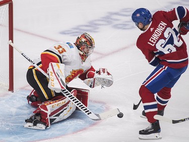 Artturi Lehkonen moves in on Calgary Flames goaltender David Rittich during first-periodaction in Montreal, Tuesday, Oct/ 23, 2018.