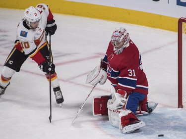 Calgary Flames' Derek Ryan moves in on Carey Price during first-period action in Montreal, Tuesday, Oct. 23, 2018.