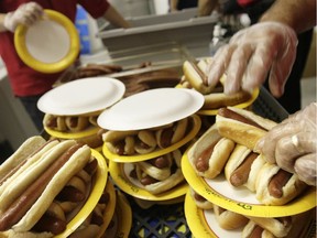 Plates of hot dogs are prepared for a hot-dog-eating competition in New York.