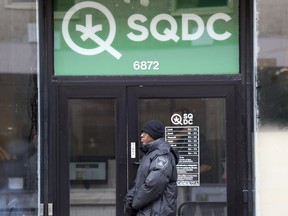 A security guard mans the front door of Société québécoise du cannabis store on St-Hubert St. in Montreal.