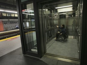 A métro commuter uses the elevator at the Montmorency station in Laval.
